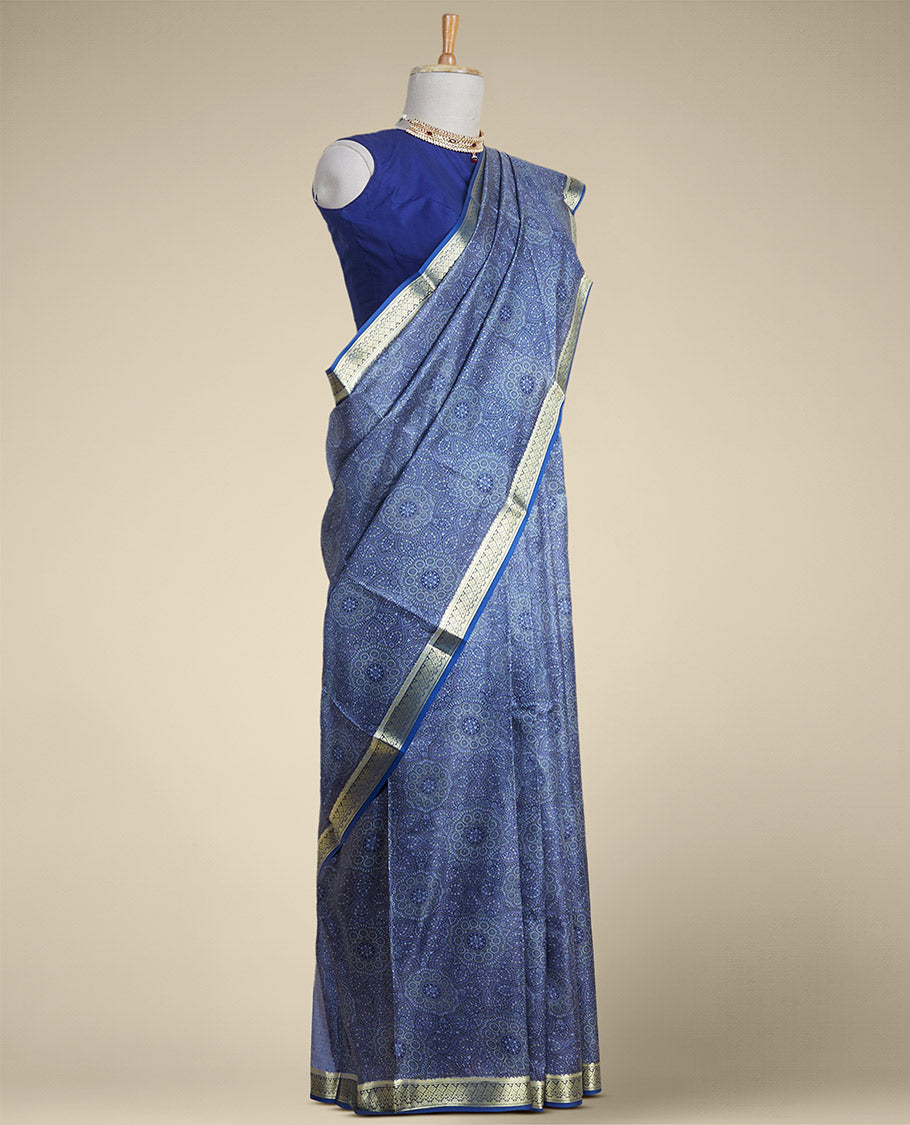 Blue floral kaleidoscopic design printed silk saree with contrast intricate zari border