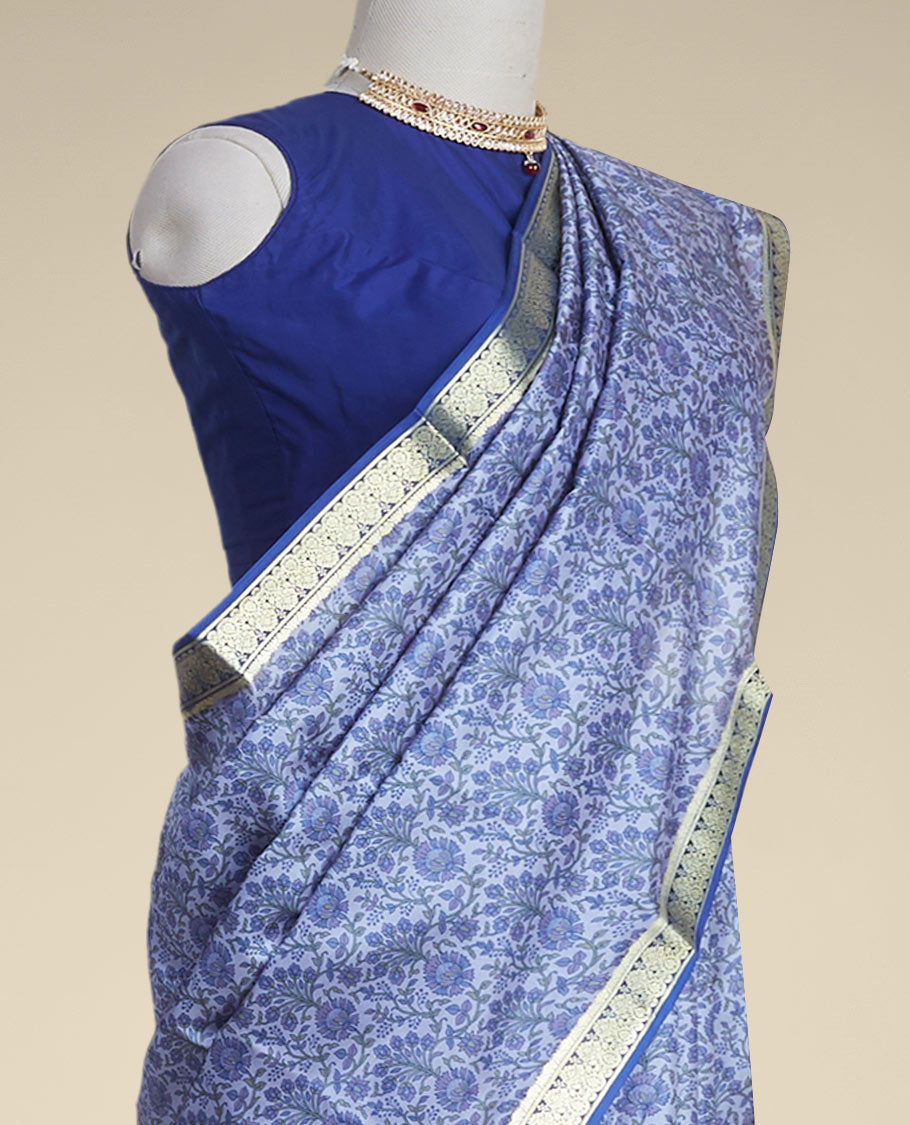 Blue floral vine design printed silk saree with contrast striped zari border