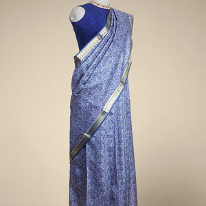 Blue floral vine design printed silk saree with contrast striped zari border