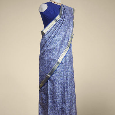 Blue floral vine design printed silk saree with contrast striped zari border