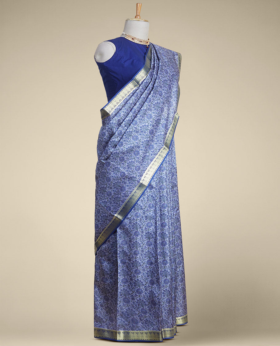 Blue floral vine design printed silk saree with contrast striped zari border