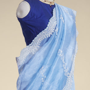 Blue floral emboridery tissue silk saree with scallop floral border