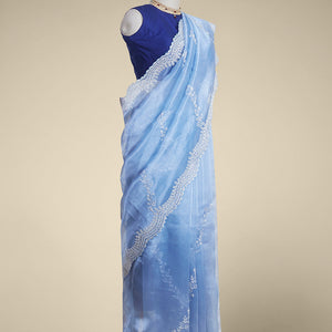 Blue floral emboridery tissue silk saree with scallop floral border