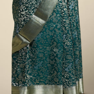 Green floral embroidery pure crepe saree with self intricate zari design border