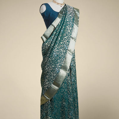 Green floral embroidery pure crepe saree with self intricate zari design border