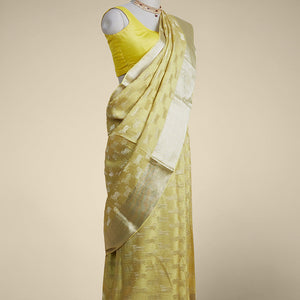Yellow anial motifs pure crepe saree with self zari border