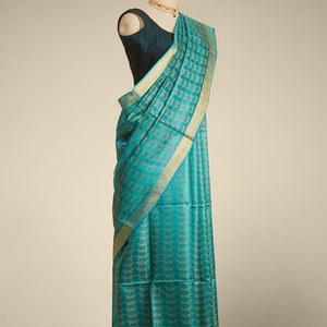 Green  intricate design  tusser silk saree with self zari border