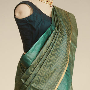 Green zig- zag striped design tusser silk saree with contrast zari border