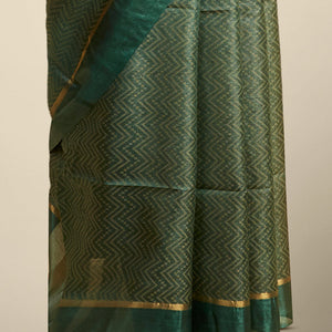 Green zig- zag striped design tusser silk saree with contrast zari border