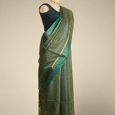 Green zig- zag striped design tusser silk saree with contrast zari border