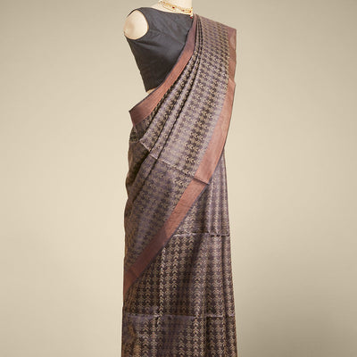 Brown floral design tusser silk saree with self zari border