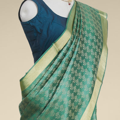 Green floral design tusser silk saree with self zari border