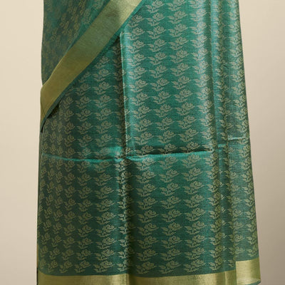 Green floral design tusser silk saree with self zari border