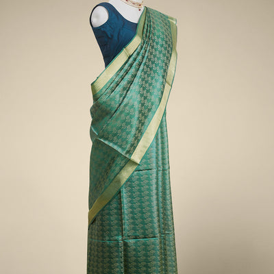 Green floral design tusser silk saree with self zari border