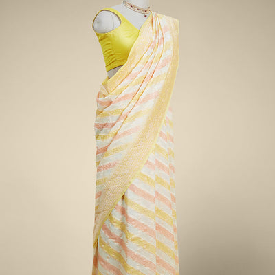 Yellow rangkat style banaras georgette saree with contrast floral zari border