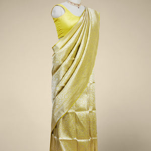 Yellow floral jacquard banaras silk saree with self intricate zari border