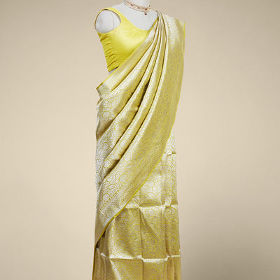 Yellow floral jacquard banaras silk saree with self intricate zari border