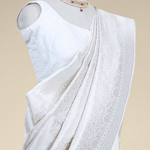Cream floral jacquard banaras silk saree with self intricate zari border