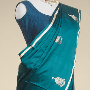 Green buttas kathan silk saree  with self zari border
