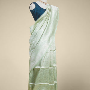 Green floral jacquard kathan silk saree with self-intricate zari border