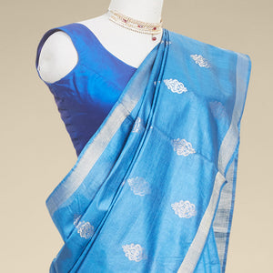 Blue  floral buttas tusser silk saree with self zari border
