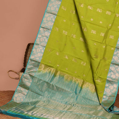 Green floral buttas silk saree with contrast leaf design border &  intricate jaal zari design pallu