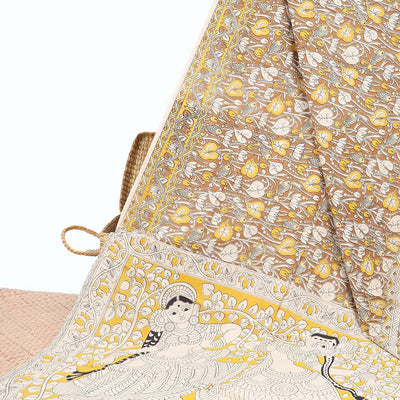 Brown floral machine-printed kalamkari cotton saree, floral creeper border & contrast human figurines pallu