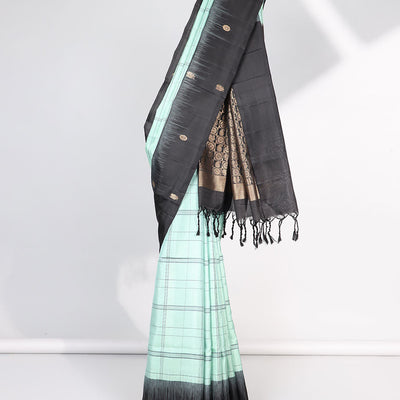 Green checked mayuri soft silk saree with contrast floral border & checked zari design pallu