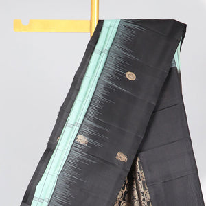 Green checked mayuri soft silk saree with contrast floral border & checked zari design pallu