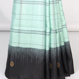 Green checked mayuri soft silk saree with contrast floral border & checked zari design pallu