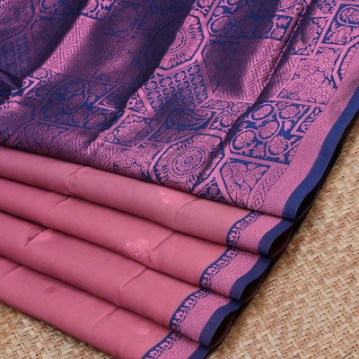 Pink butter silk with rose copper zari buttas, contrast zari border & pallu elevated with intricate zari designs