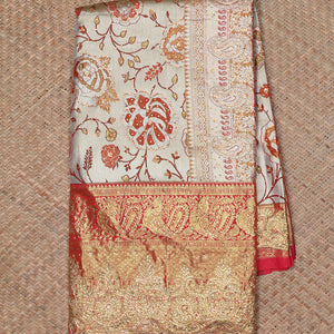 Cream floral jacquard & stone embroidery silksaree,contrast zari & stonework scallop border & intricate pallu
