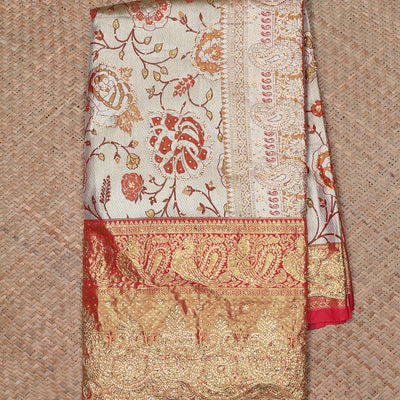 Cream floral jacquard & stone embroidery silksaree,contrast zari & stonework scallop border & intricate pallu