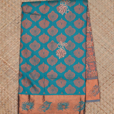 Blue silksaree with zari buttas & stone work, zari border & intricate floral design weave pallu with stone embroidery