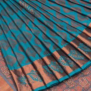 Blue silksaree with zari buttas & stone work, zari border & intricate floral design weave pallu with stone embroidery