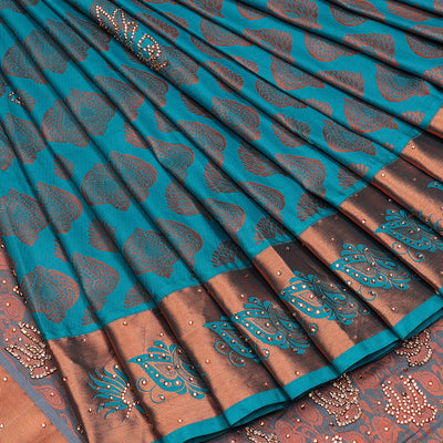 Blue silksaree with zari buttas & stone work, zari border & intricate floral design weave pallu with stone embroidery