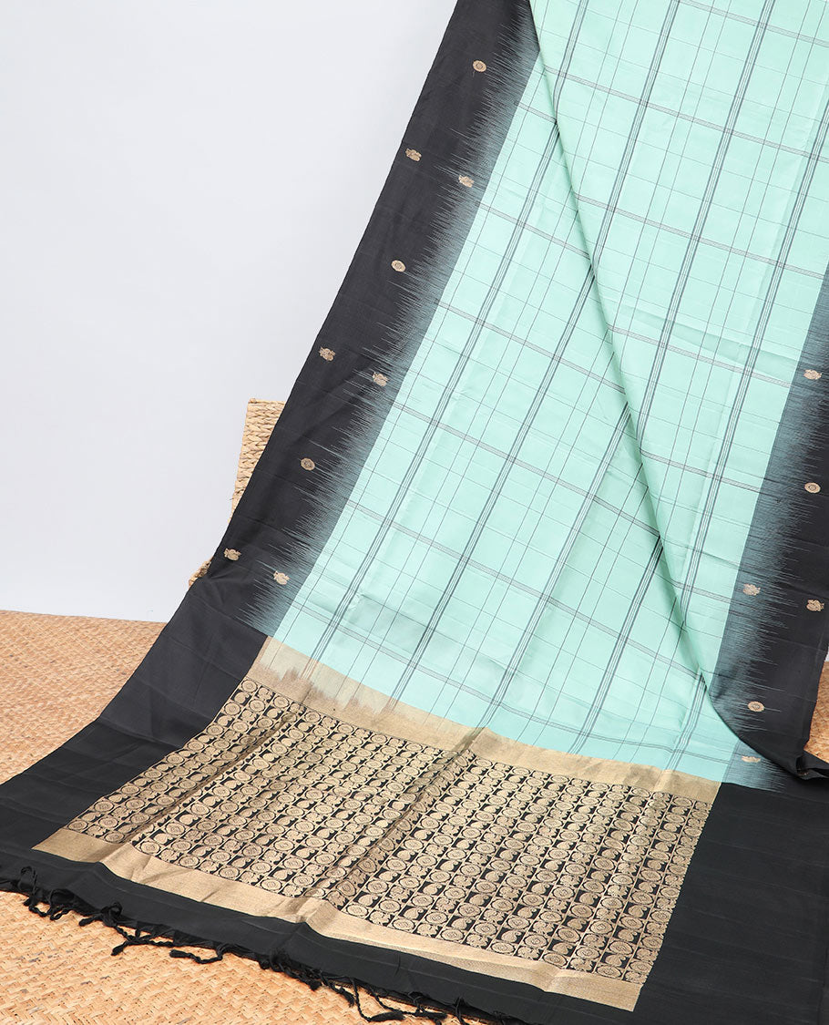 Green checked mayuri soft silk saree with contrast floral border & checked zari design pallu