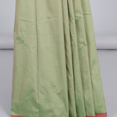 Borderless pastel green aarani gift saree with unique buttas, contrast pallu of traditional designs