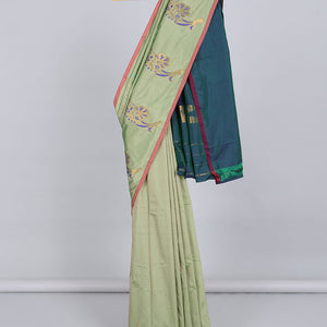 Borderless pastel green aarani gift saree with unique buttas, contrast pallu of traditional designs