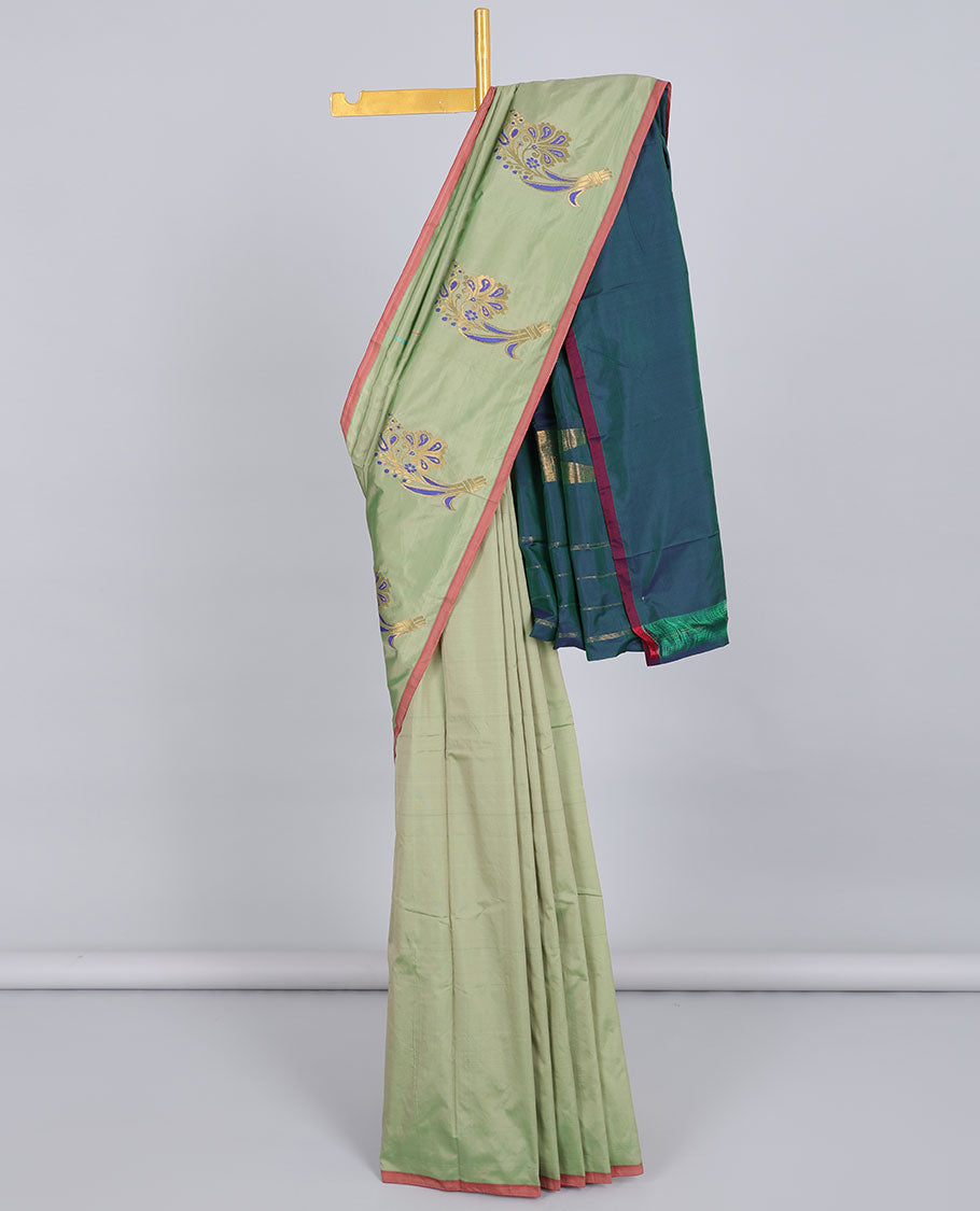 Borderless pastel green aarani gift saree with unique buttas, contrast pallu of traditional designs