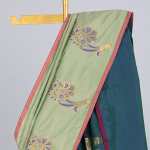 Borderless pastel green aarani gift saree with unique buttas, contrast pallu of traditional designs
