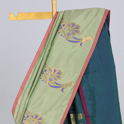 Borderless pastel green aarani gift saree with unique buttas, contrast pallu of traditional designs