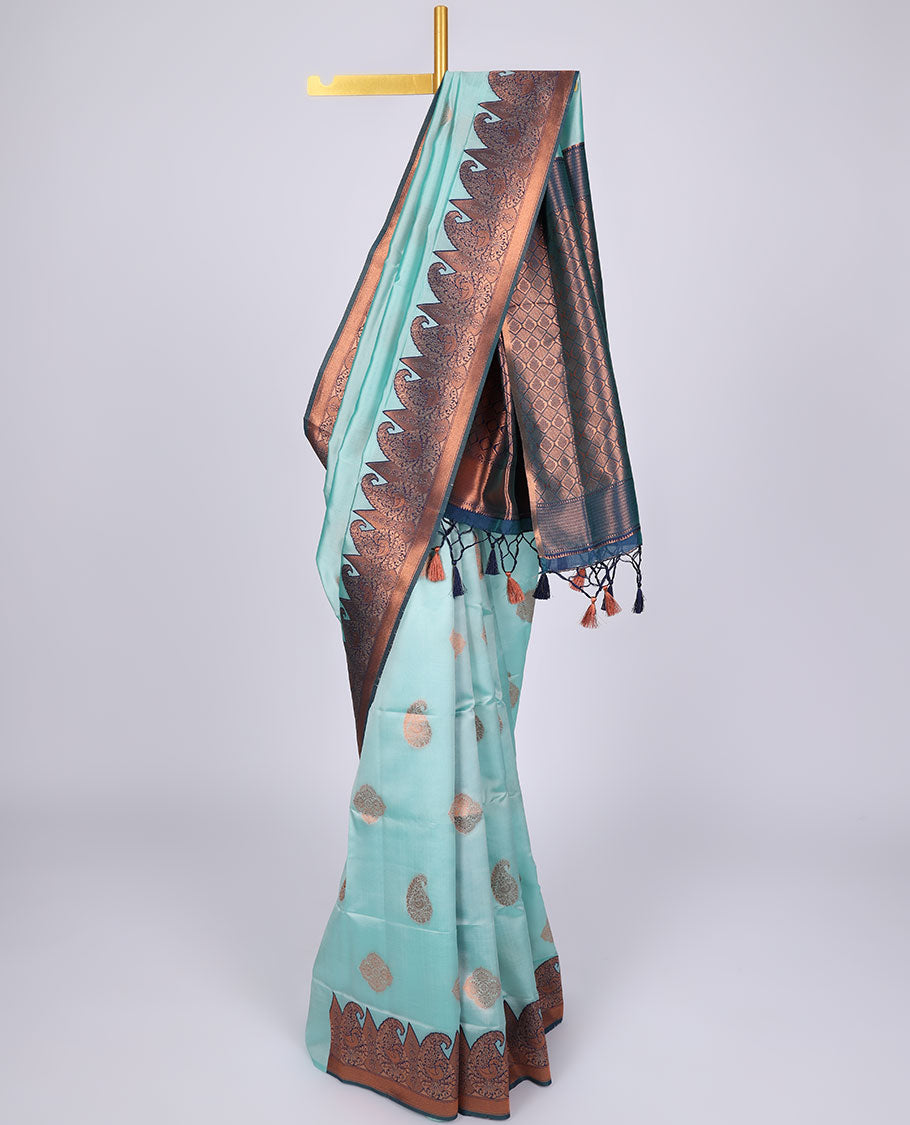 Pastel blue butter silk saree with zari buttas, contrast border of paisleys & peacock & ogee patterned pallu