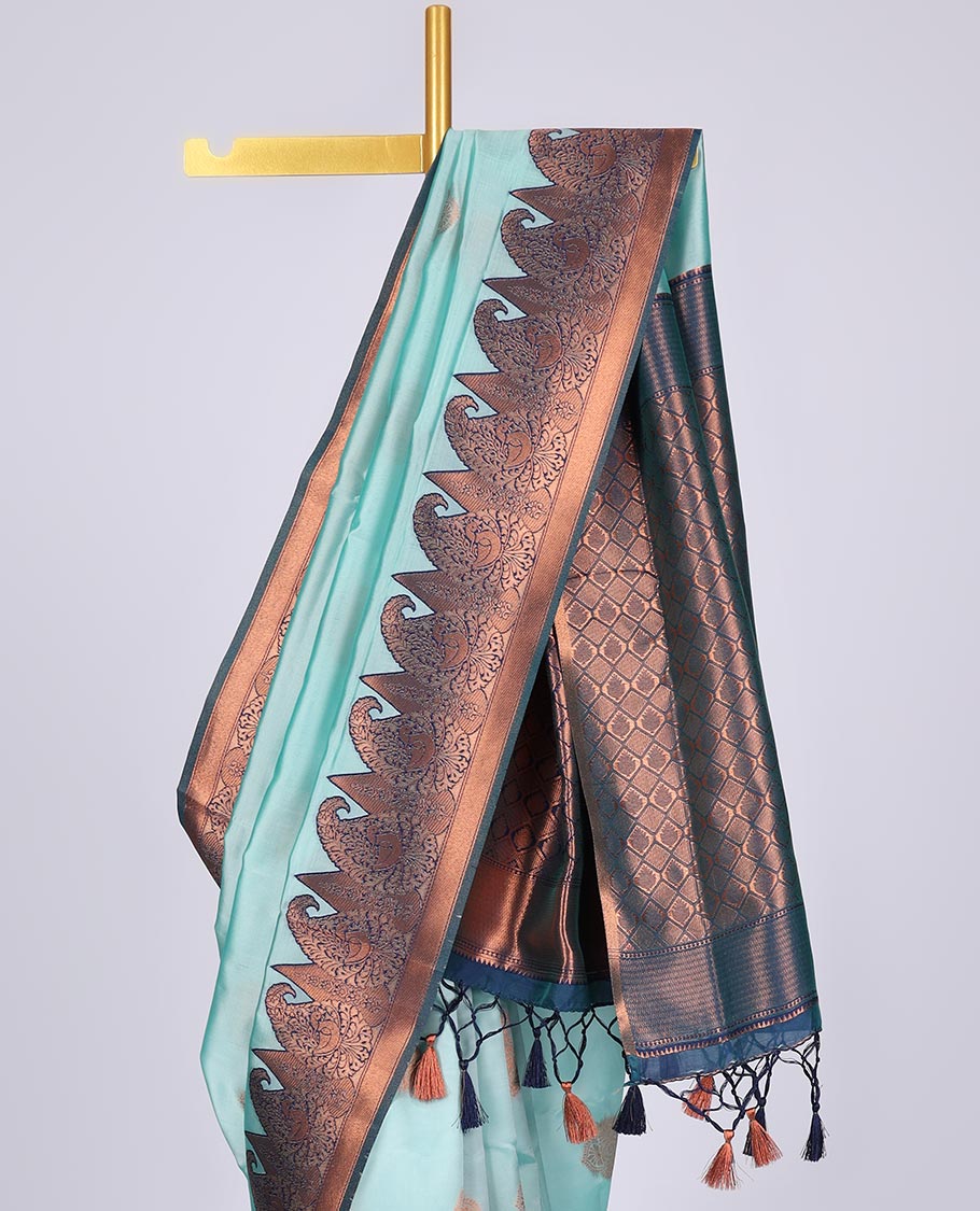 Pastel blue butter silk saree with zari buttas, contrast border of paisleys & peacock & ogee patterned pallu