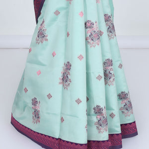 Celeste blue butter silk saree with floral buttas, contrast rose copper zari design border & intricate pallu