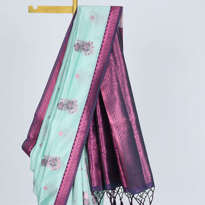 Celeste blue butter silk saree with floral buttas, contrast rose copper zari design border & intricate pallu