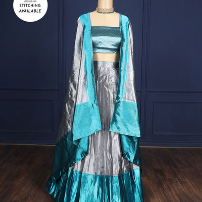 Silver grey tissue half-saree, contrast traditional motifs border, jacquard blouse & dhavani of intricate designs