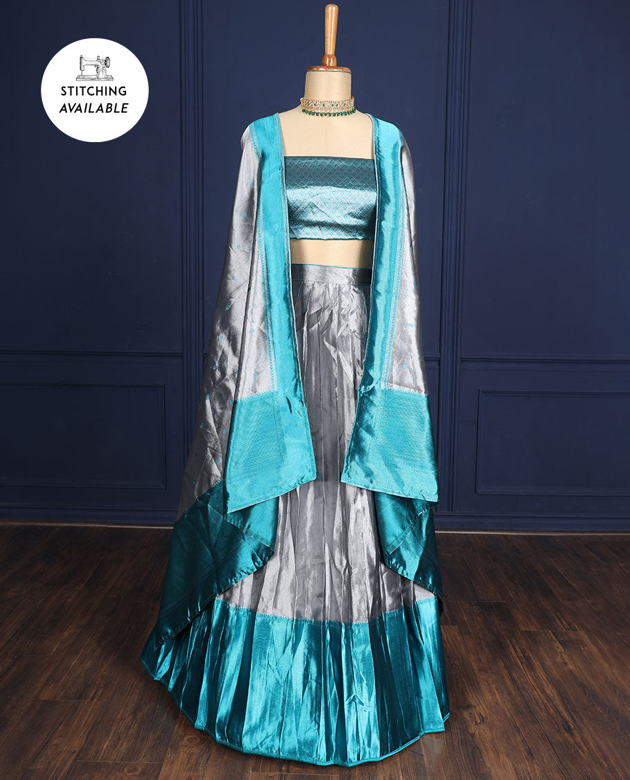 Silver grey tissue half-saree, contrast traditional motifs border, jacquard blouse & dhavani of intricate designs