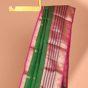 Green mayil buttas silk saree, contrast mayil chakram Checked pallu & border Neli,muthu & mayil designs