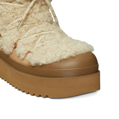 Tory Burch Mellow Shearling Platform Boots.